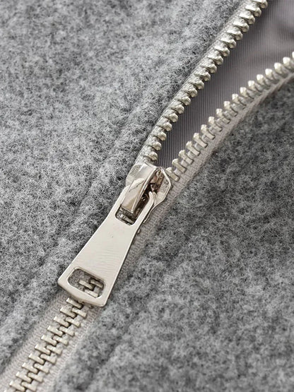 "Dames grijze bomberjas met ritssluiting, elastische tailleband en moderne oversized fit voor een stijlvolle casual look."