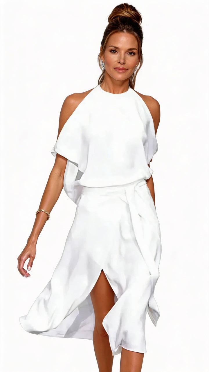 Elegante dames halter midijurk met trendy open schouders, perfect voor zomerse feestjes of een cocktail.
