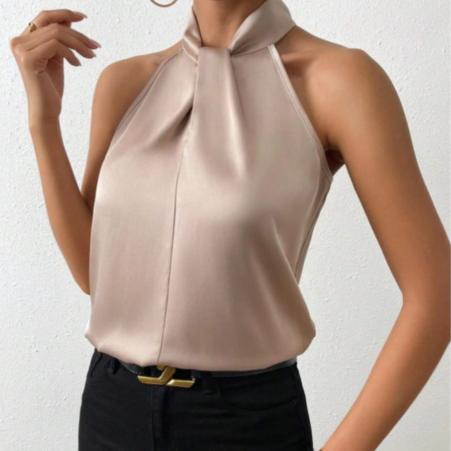 Elegante dames haltertop met unieke gedraaide hals, perfect voor trendy avondkleding.
