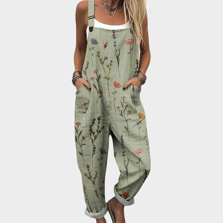 Groene dames jumpsuit met bloemenprint, wijde pijpen en verstelbare banden, ideaal voor de zomer.