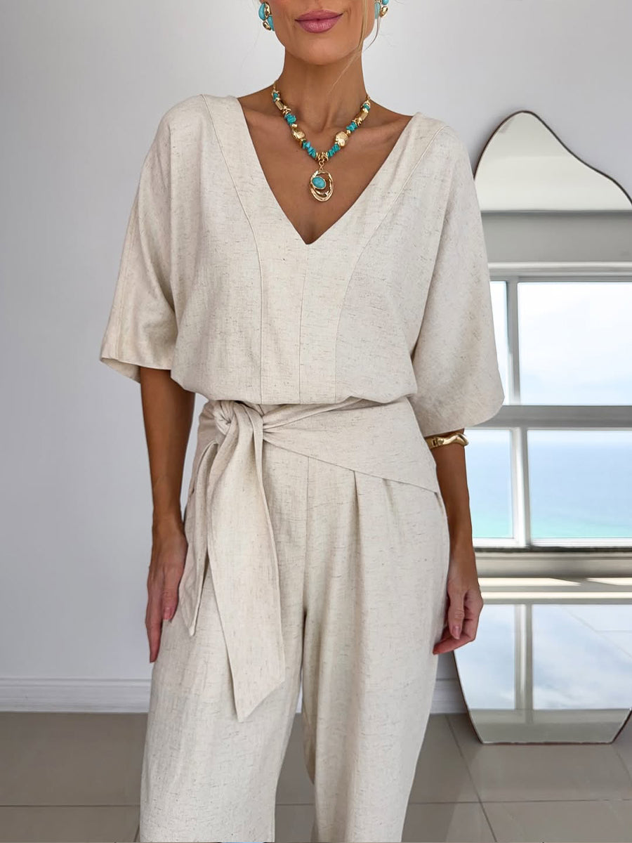 Stijlvolle enkellange jumpsuit voor dames, met wijde pijpen, V-hals en modieuze vleermuismouwen.