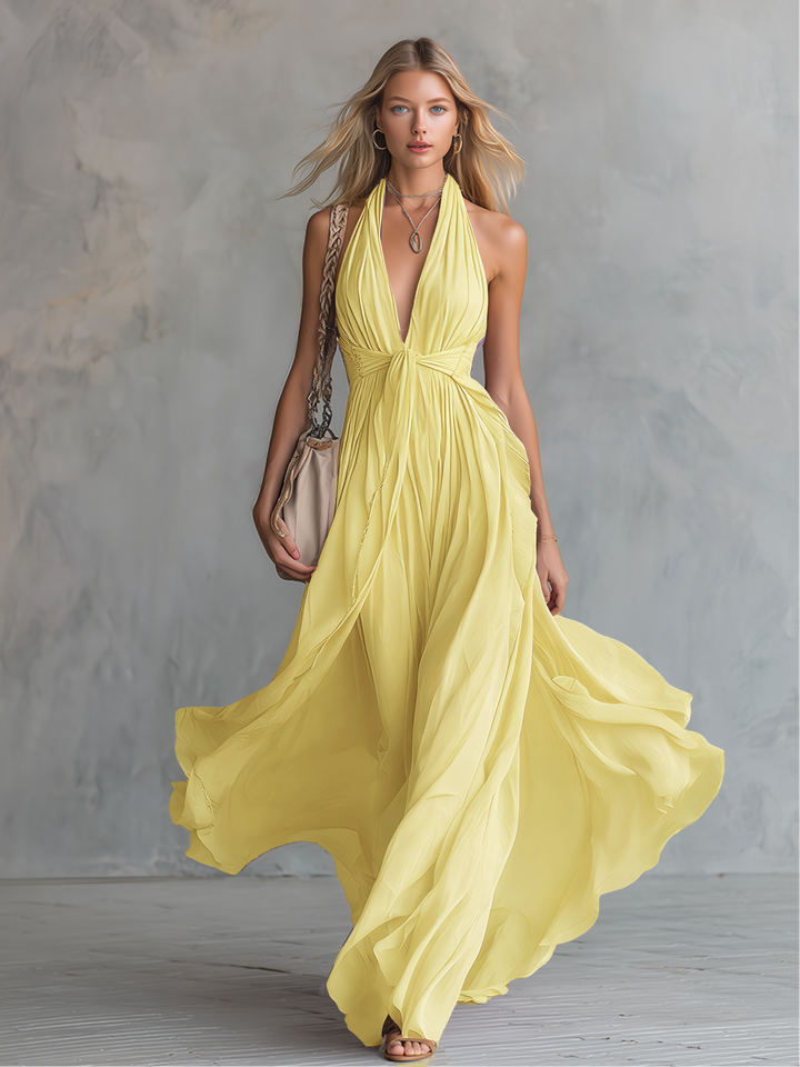 Formele dames jurk, A-lijn silhouet, halternek en diepe V-hals. Ideaal als avondkleding.