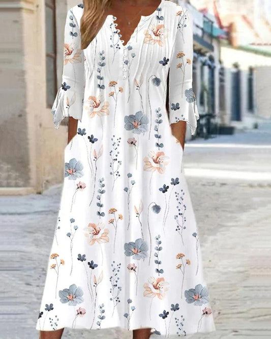 Dames midi jurk met elegante bloemenprint, flatterende pasvorm en vrouwelijke stijl, ideaal voor speciale gelegenheden.