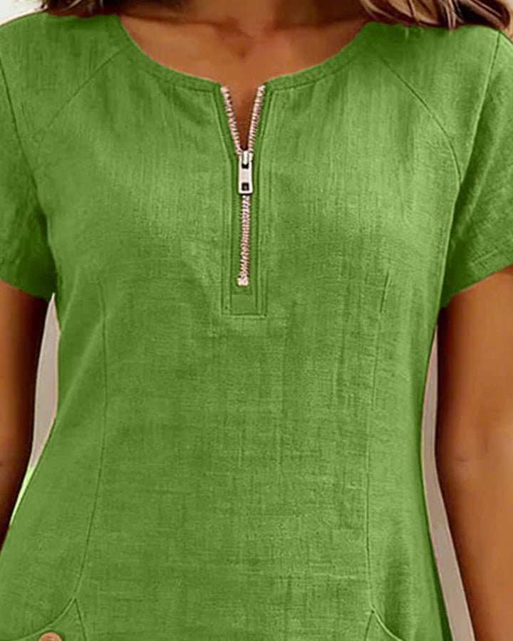 Comfortabele casual mini jurk dames. Korte mouw, ronde hals, zakken & rits. Perfect voor dagelijks.