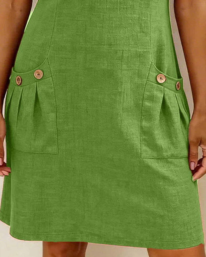 Trendy A-lijn mini jurk voor dames. Korte mouw, ronde hals, rits en handige zakken.