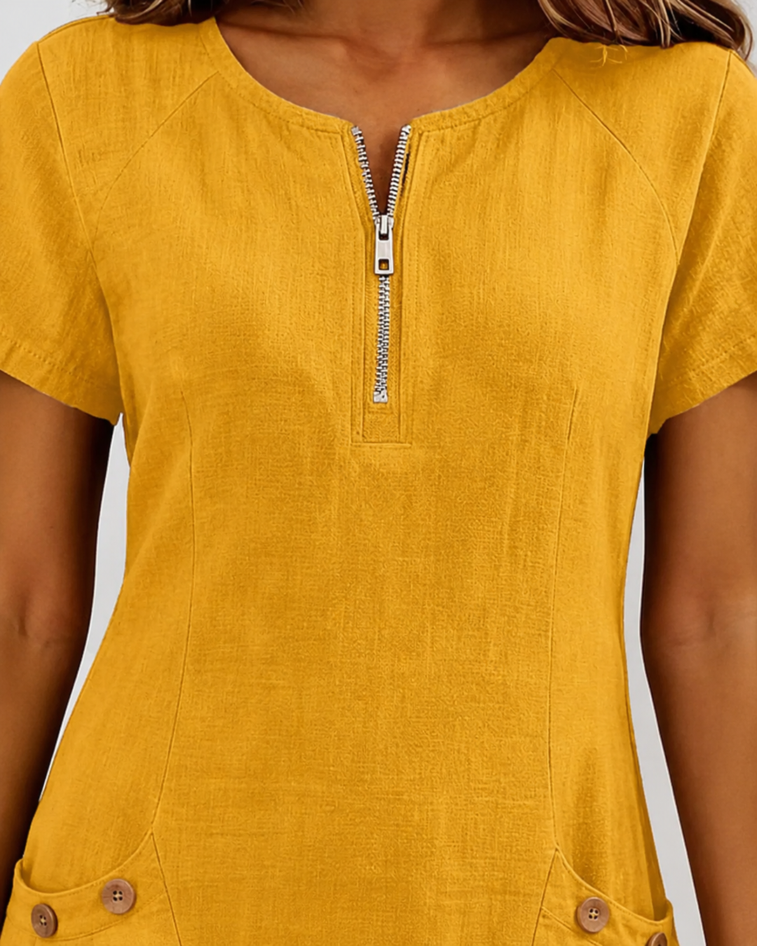 Comfortabele lentejurk dames. Mini lengte, korte mouw, ronde hals, rits en praktische zakken.
