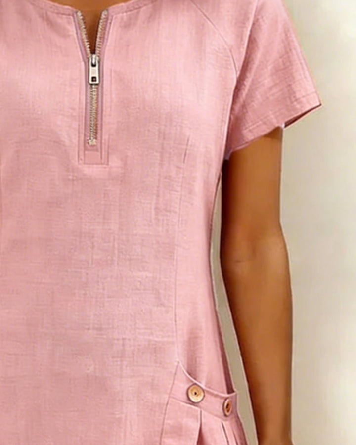 Dames mini jurk, korte mouw, ronde hals, rits & zakken. Perfect voor lente en zomerse dagen.
