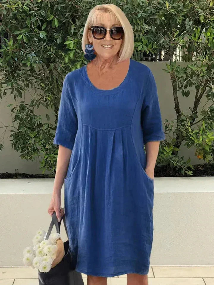 Comfortabele A-lijn midi jurk voor dames met praktische zijzakken, ideaal voor een relaxte lente- of zomeroutfit.