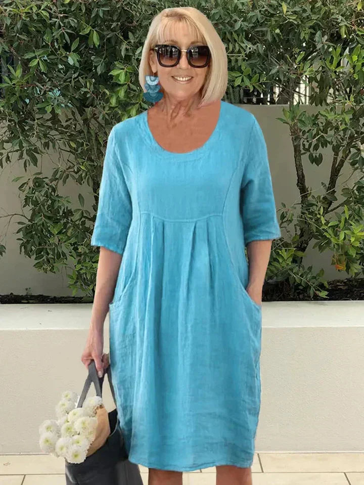 Elegante dames A-lijn midi jurk met 3/4 mouwen en handige zakken, perfect voor casual of zomerse looks.