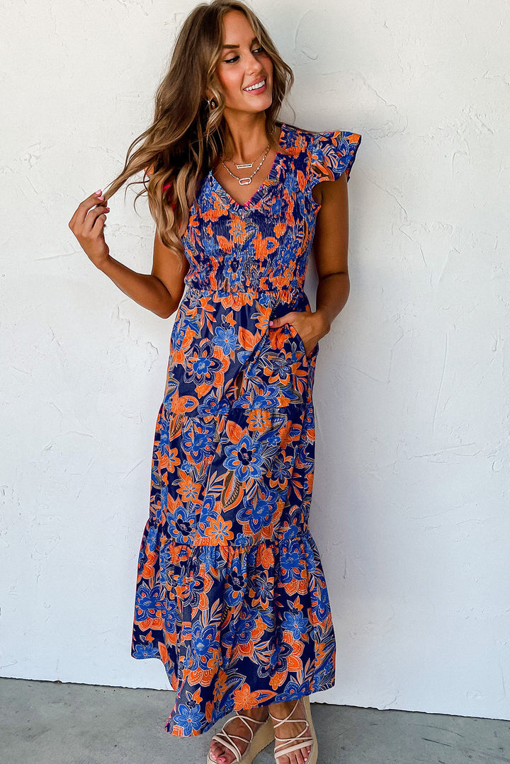 Modieuze blauwe bloemenprint maxi zomerjurk voor dames, met V-hals en smocked details voor een frisse look.