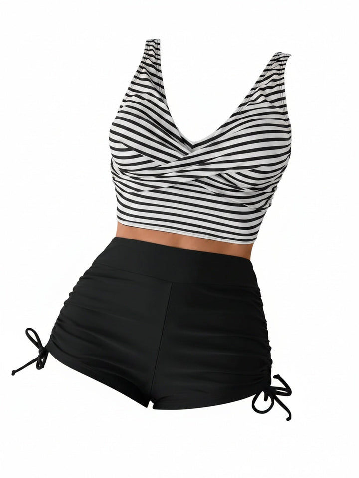 Dames tankini set met hoge taille en gestreepte twist front V-hals top, ideaal voor strand en zwembad.
