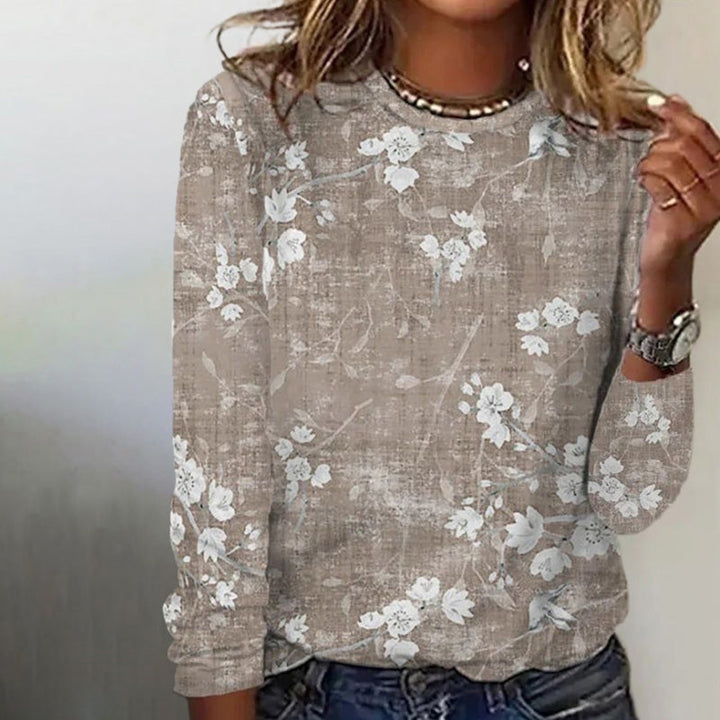 Stijlvolle dames top met lange mouwen en verfijnde bloemenprint. Khaki vrouwenmode voor een comfortabele dagelijkse outfit.