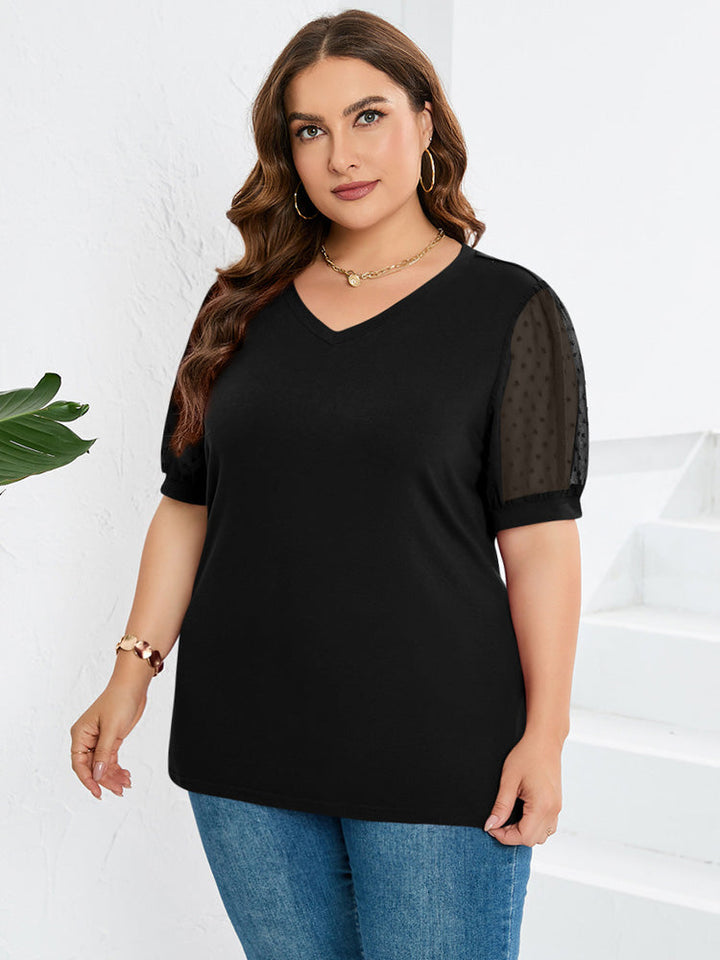 Stijlvolle damesblouse, voorzien van modieuze pofmouwen en een verfijnde V-hals, perfecte bovenkleding.