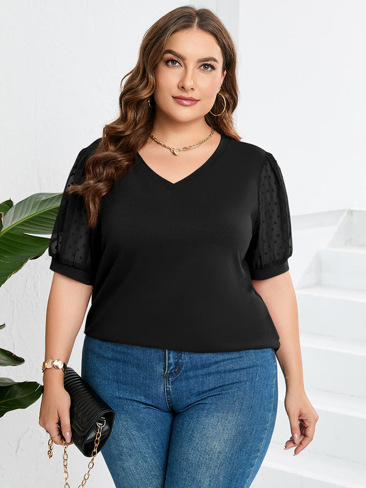 Casual dames top met unieke pofmouwen en diepe V-hals, een stijlvol kledingstuk voor elke gelegenheid.