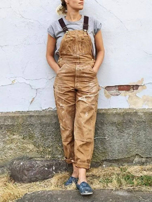 "Dames tuinbroek met verstelbare bretels, retro stijl, navy kleur, voorzijde met zakken, duurzaam en tijdloos ontwerp."