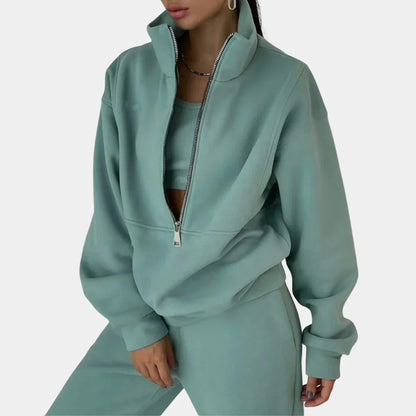 "Dames tweedelig trainingspak: elegante sweater, hoge taille broek, comfortabele pasvorm, ideaal voor casual stijl."