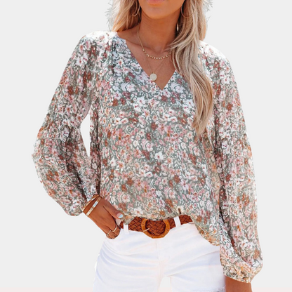 "Damesblouse met lange mouw en bloemenprint, ideaal voor de zomer, elegante look in roze, wit of groen."