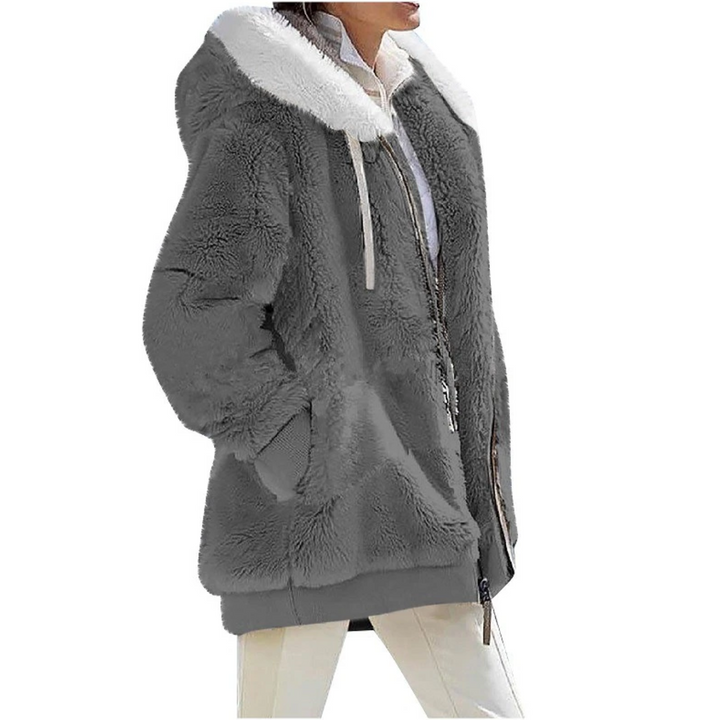 Extra warm kasjmierfleece damesvest met capuchon, perfect voor koude dagen, comfortabele bovenkleding.