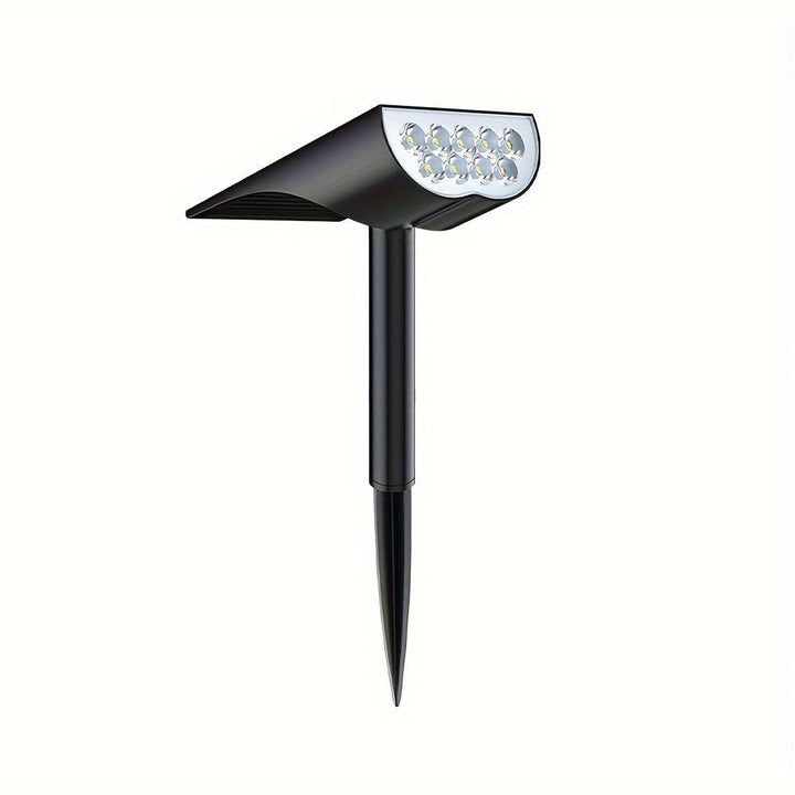 9 LED solar tuinlamp tussen planten, perfecte landschapsverlichting op zonne-energie voor een natuurlijke look.