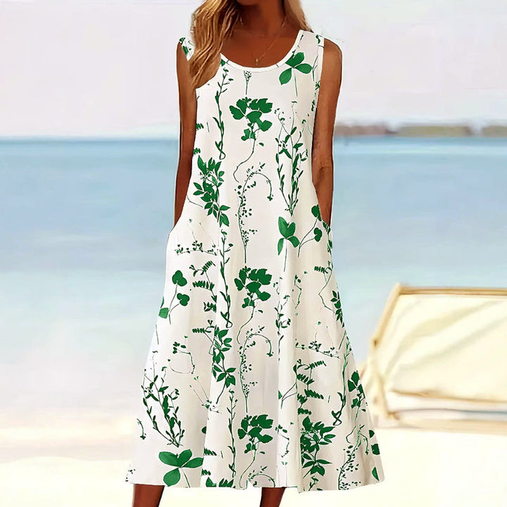 Mouwloze A-lijn dames midi jurk met fleurige bloemenprint, een veelzijdige elegante zomerjurk.