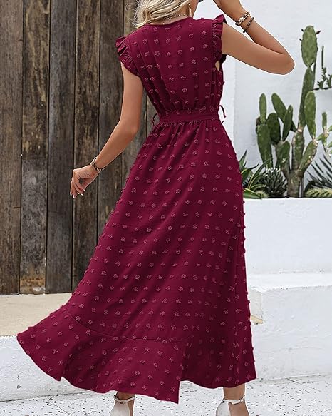 Zwarte geplooide dames midi jurk met contrasterende stippen, ultiem elegant voor speciale momenten.