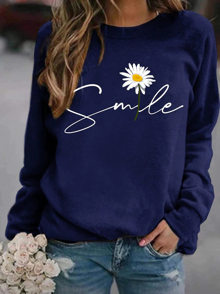Comfortabele trui voor dames met vrolijke 'smile' print. Een trendy ronde kraag trui uit de nieuwe collectie.