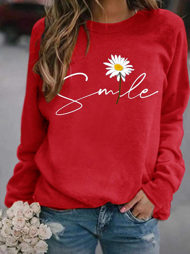 Dames comfortabele trui met vrolijke 'smile' print, zacht en ideaal voor casual damesmode uit de nieuwe collectie.