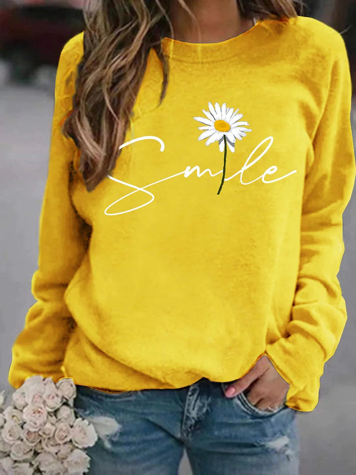 Casual dames trui met opvallende 'smile' print. Deze modetrui biedt ultiem comfort en een vrolijke look.