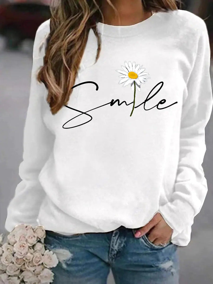 Dames trui met levendige 'smile' print en ronde kraag, perfect voor comfort en een vrolijke, casual uitstraling.