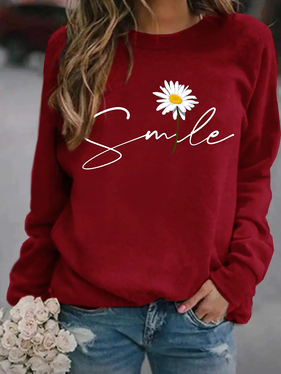 Vrolijke 'smile' trui voor dames, een comfortabele trui met print uit de nieuwe collectie damesmode.
