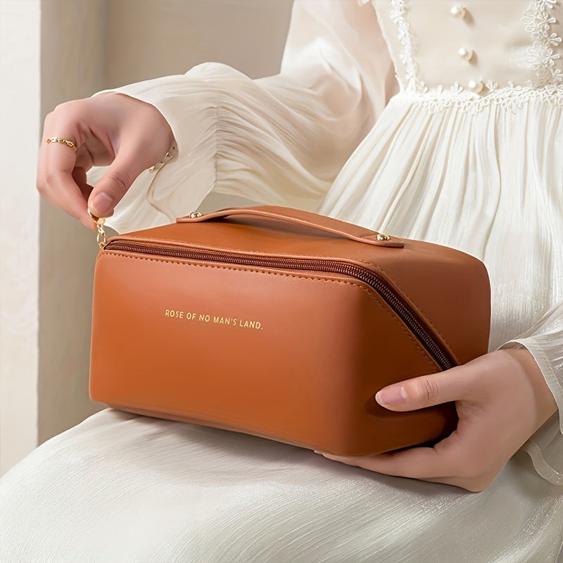 Zwarte make-up organizer met ritssluiting, elegante reis toilettas voor dames beauty accessoires.