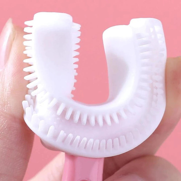 Roze U-vormige tandenborstel voor kinderen. Zachte 360° reiniging met siliconen voor baby's en junioren.