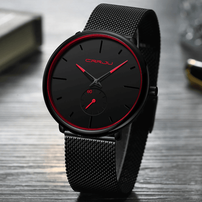 "Dun minimalistisch herenhorloge met elegante zwarte wijzerplaat, roestvrijstalen mesh-band en luxe uitstraling."