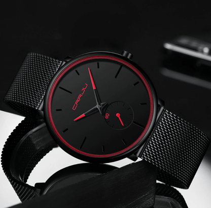 "Dun minimalistisch herenhorloge met elegante zwarte wijzerplaat, roestvrijstalen mesh-band en luxe uitstraling."