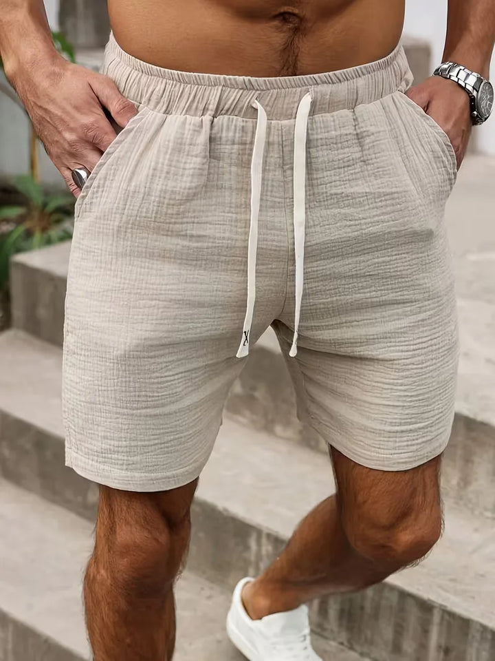 Casual beige heren shorts, perfect als strandbroek of vakantiekleding, met comfortabele elastische taille.