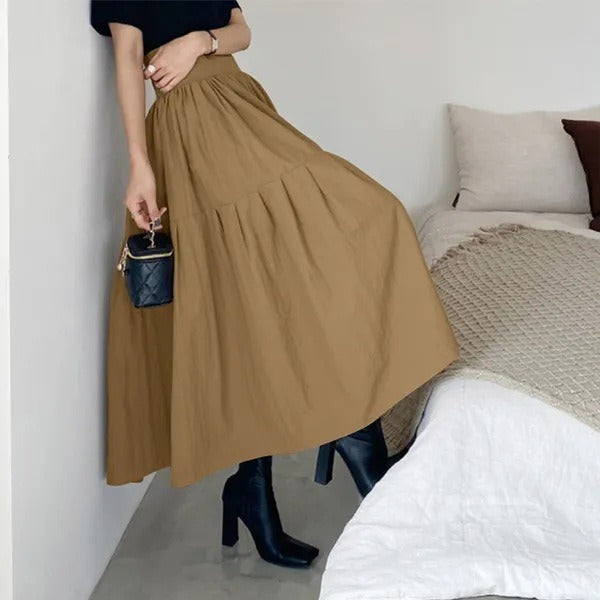 Dames maxi rok met elegante plooien en comfortabele elastische taille, perfect voor zomerse casual dagen.