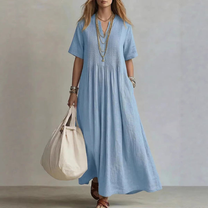 Effen losvallende dames zomerjurk met V-hals. Ideaal als comfortabele, casual of elegante strand- en reisjurk.