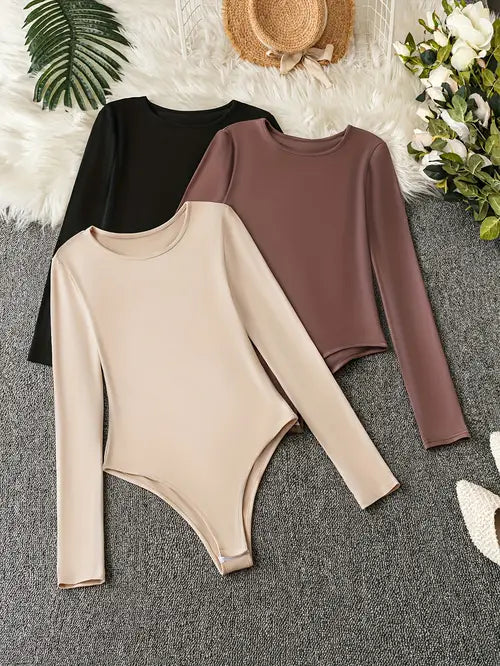 3-pack effen damesbodysuits met lange mouwen; comfortabel, modieus basisstuk voor dagelijkse stijl.