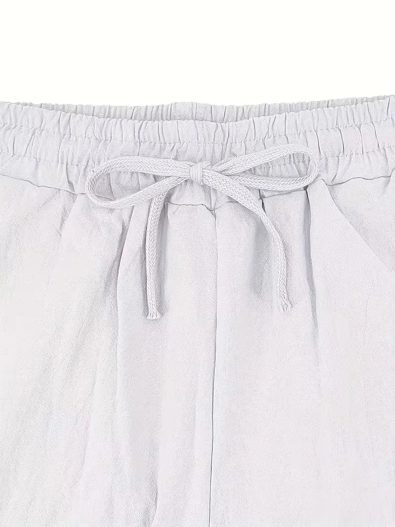 Tweedelige heren zomerset in wit, comfortabel en ademend voor warme zomerdagen.