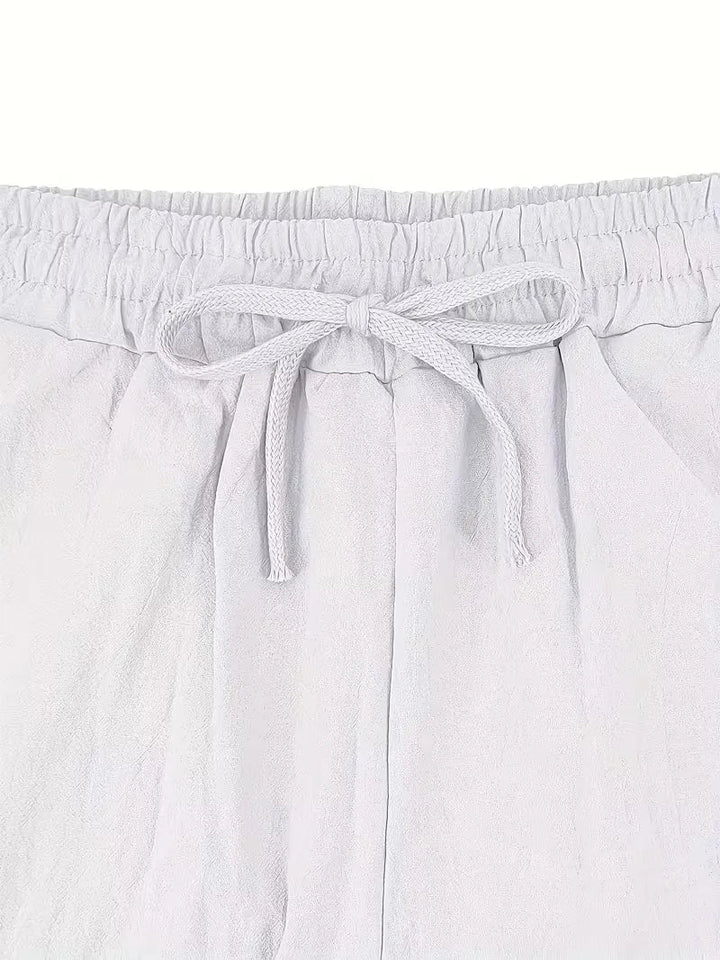 Tweedelige heren zomerset in wit, comfortabel en ademend voor warme zomerdagen.