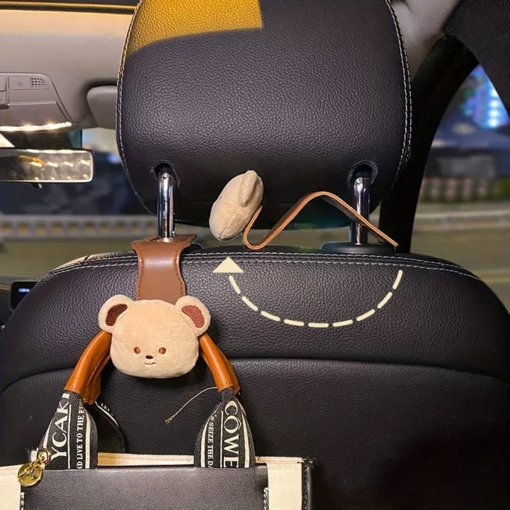 Houd je auto opgeruimd met deze handige beren autohaken, perfect om tassen en andere items van de vloer te houden.