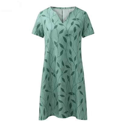 "Elegant bedrukt kleid met V-hals, korte mouwen en unieke print. Ideaal voor zonnige dagen en ontspannen uitjes."