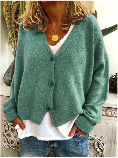 "Elegant katoenen dames vest met knopen, tijdloze stijl, zacht textuur, lange mouwen, perfect voor elke gelegenheid."