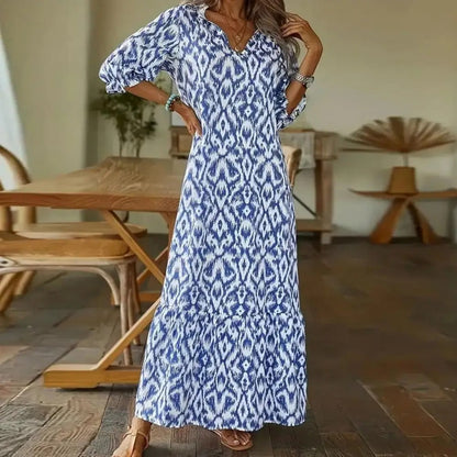 "Elegante A-lijn zomerjurk voor dames met v-hals, luchtige stof en opgerolde mouwen, ideaal voor casual zomerse dagen."