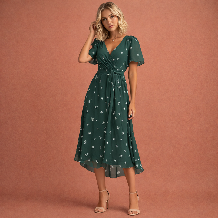 Stijlvolle midi-jurk voor dames met bloemenprint, perfect als feestjurk of vakantiejurk met korte mouwen.
