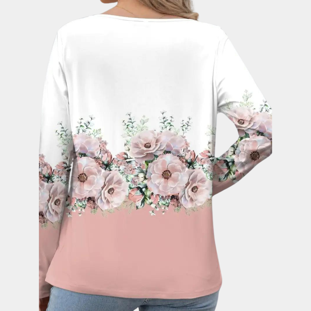 "Elegante damesblouse met bloemenpatroon in bruin, asymmetrisch design, geschikt voor casual en formele gelegenheden."