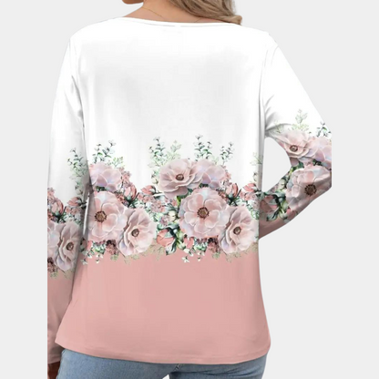 "Elegante damesblouse met bloemenpatroon in bruin, asymmetrisch design, geschikt voor casual en formele gelegenheden."