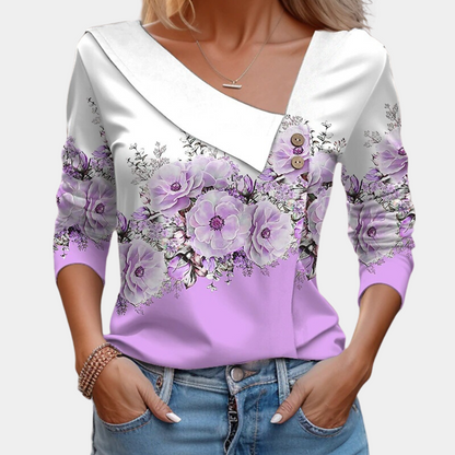 "Elegante damesblouse met bloemenpatroon in bruin, asymmetrisch design, geschikt voor casual en formele gelegenheden."