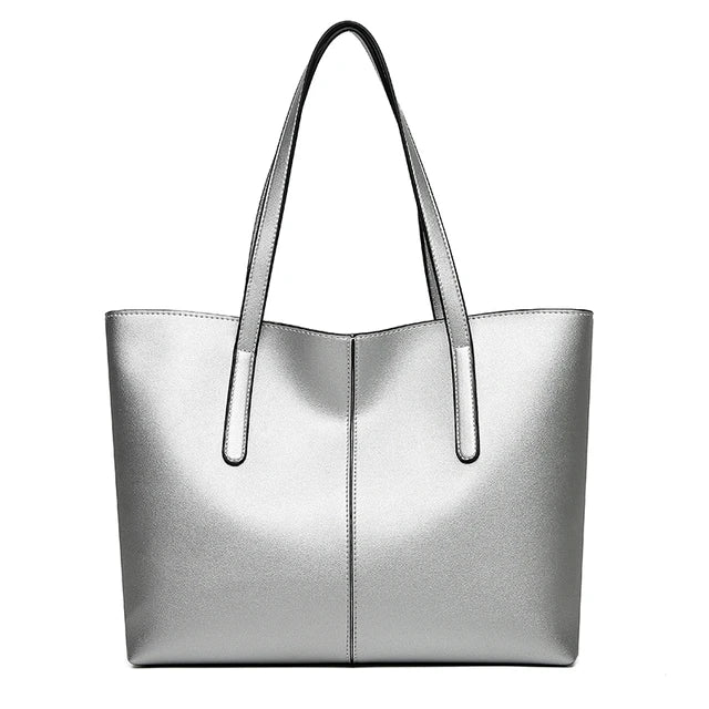 Elegante leren schoudertas in rood, met verstelbare riem en ruim interieur, perfect voor dagelijkse organisatie en stijl.