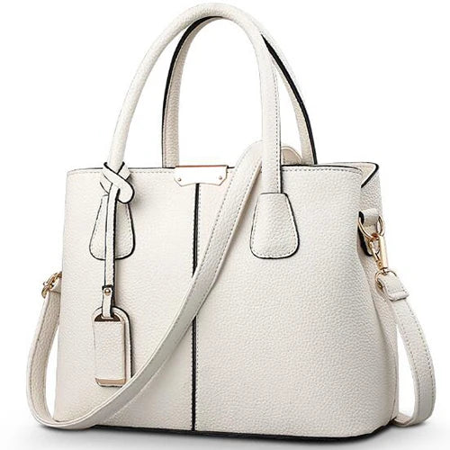Elegante leren schoudertas voor dames, stijlvol en ruim, met verstelbare riem en verschillende kleurkeuzes.